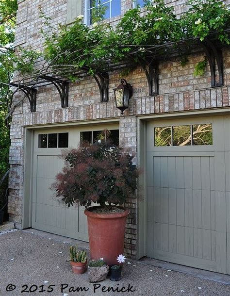 over the door metal trellis inside house|above garage door trellis.